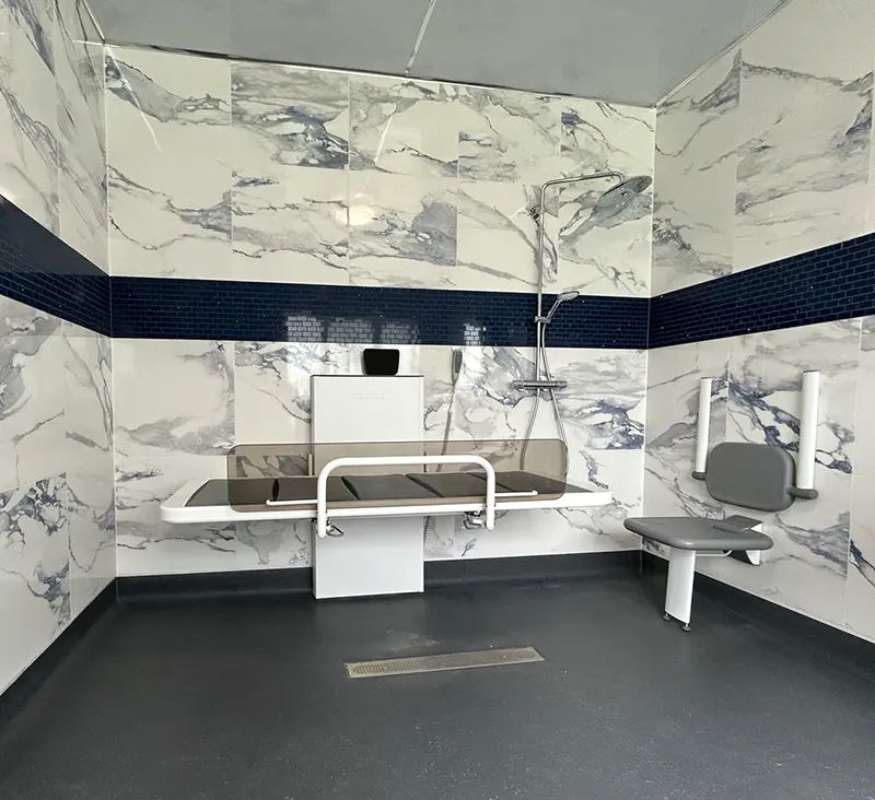 `Muhammad's wetroom with ROPOX shower changing bed and shower seat`
