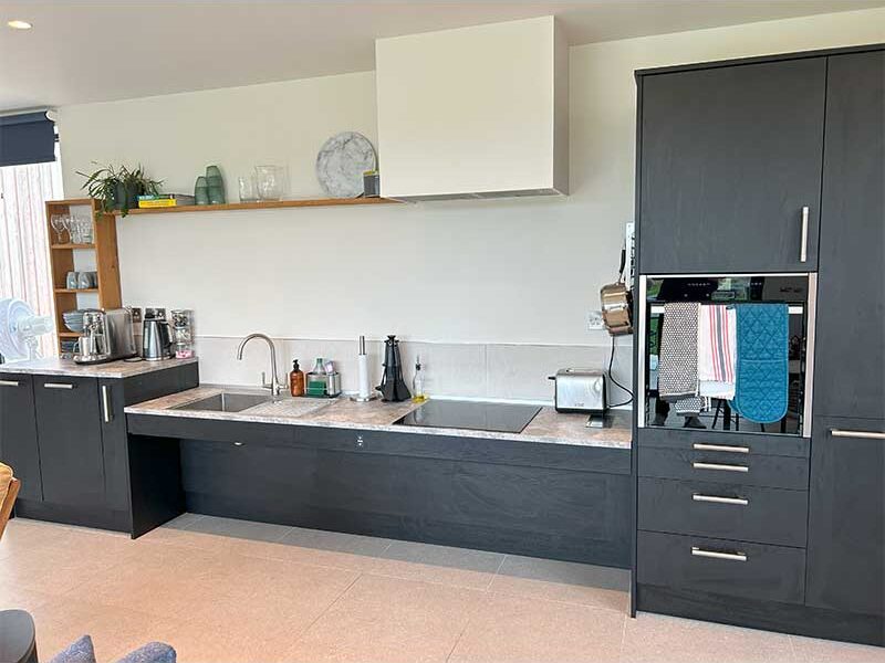 `Black accessible kitchen adjustable worktop`
